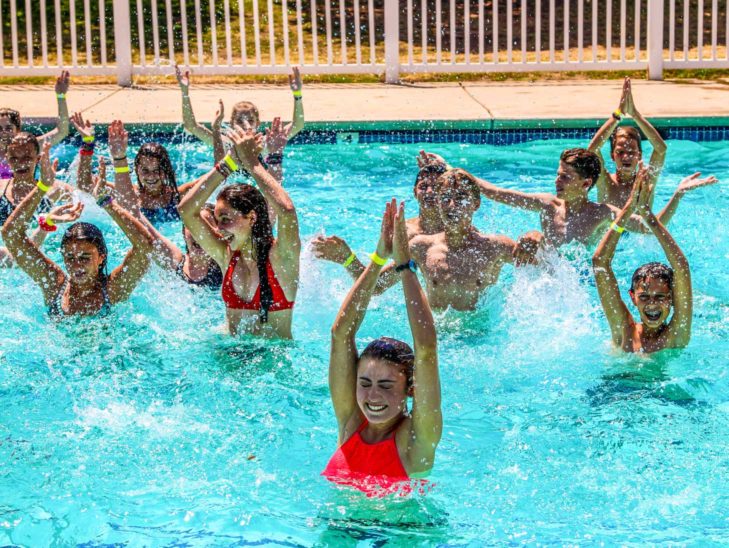 Campers practicing their water aerobics skills.