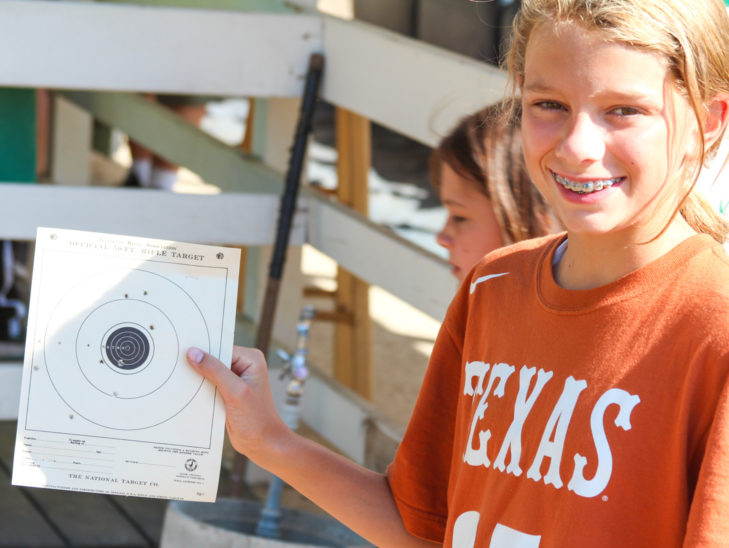 A camper showing their bb gun target sheet.