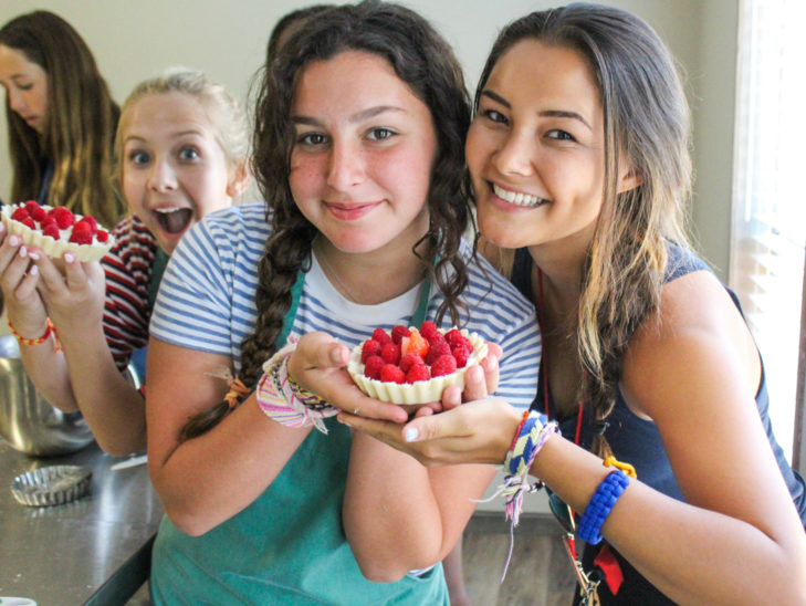 Campers posing with their dessert.