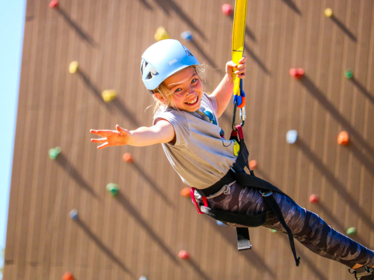 A camper on a rock wall.