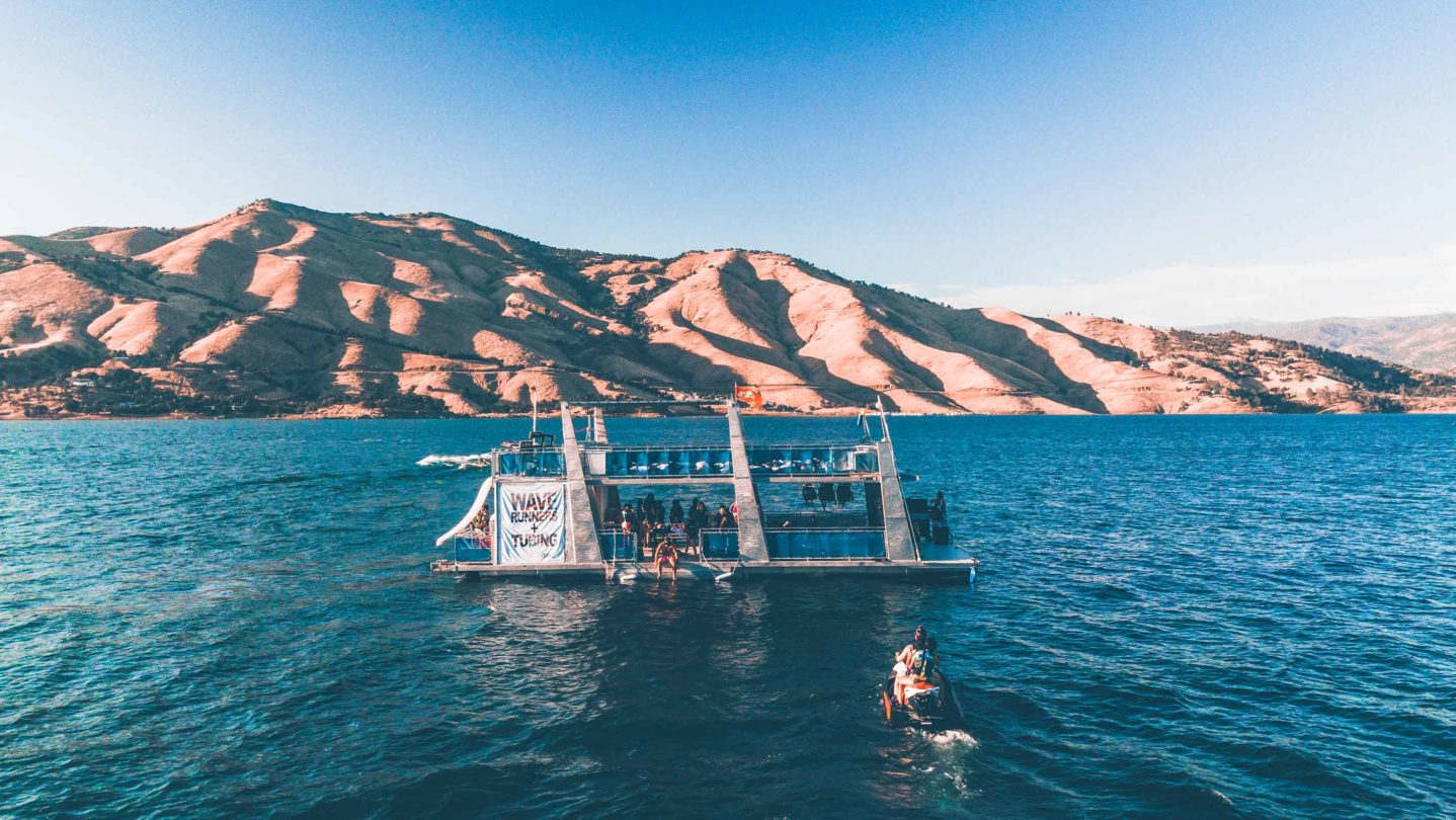 Campers using wave runners in the nearby lake.