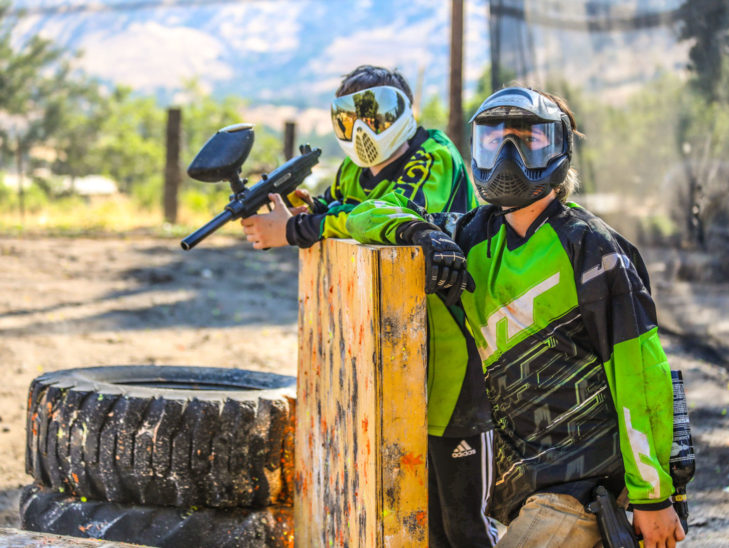 Campers playing paintball.