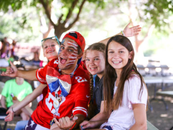 Campers sitting together having a fun time.