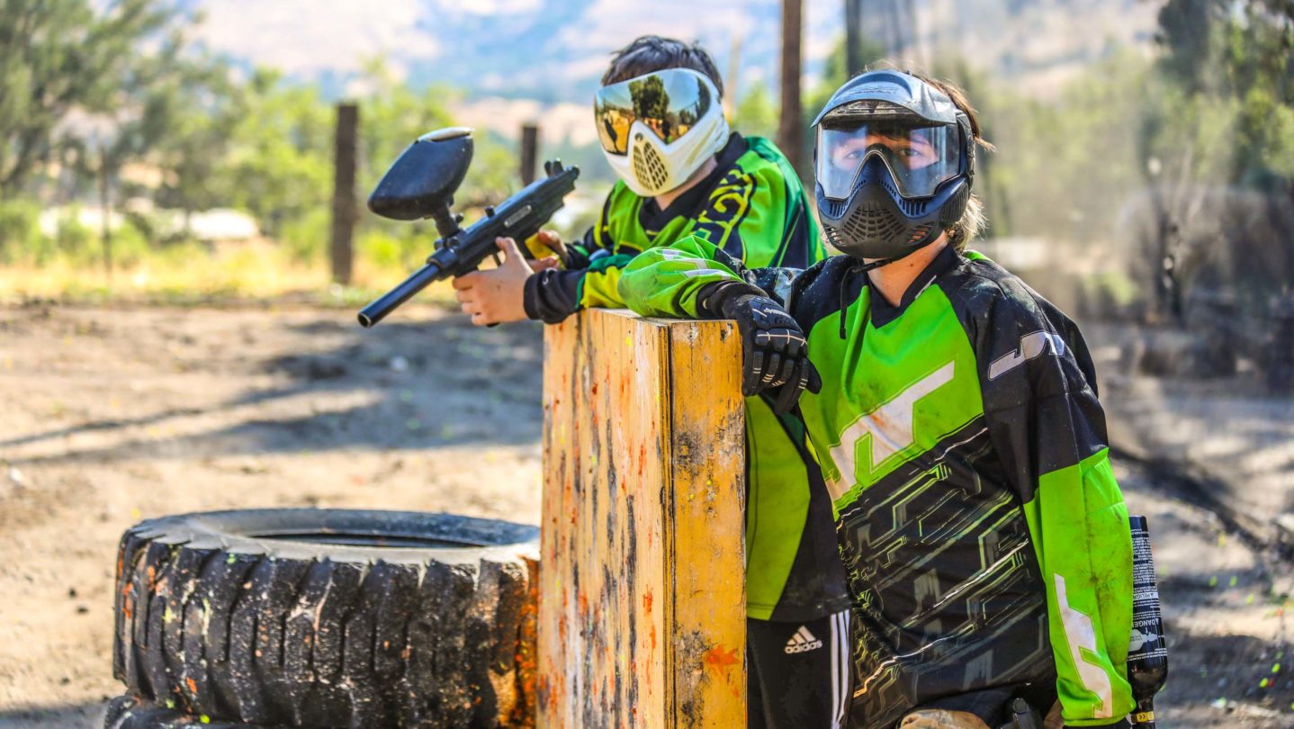 Campers posing on the paintball course