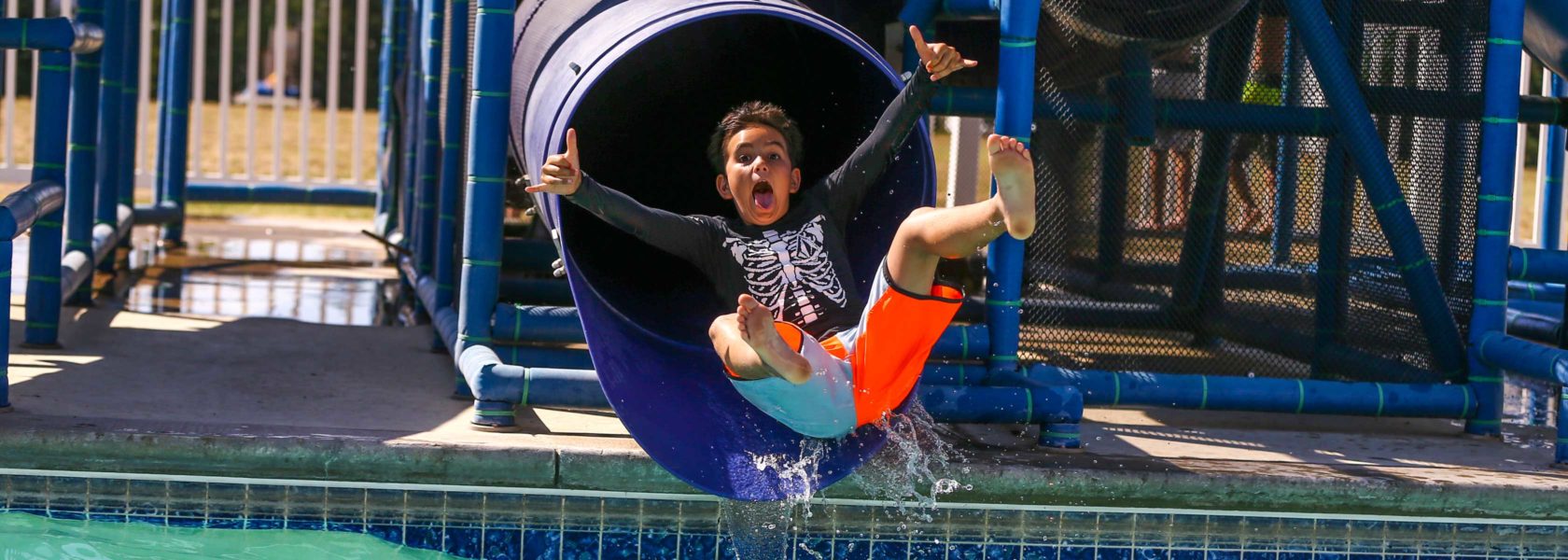 A camper going down a slide