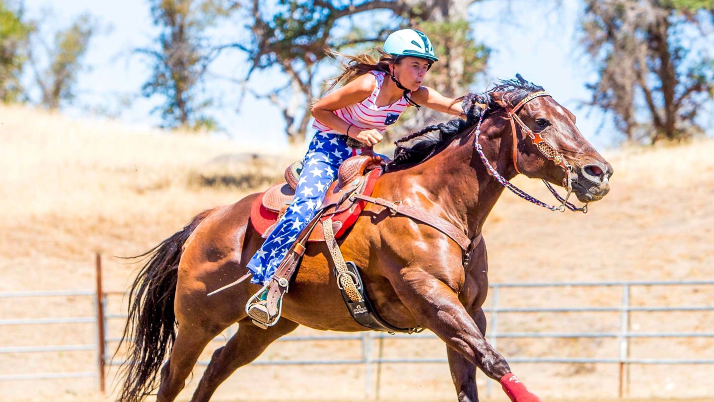 A camper riding a horse