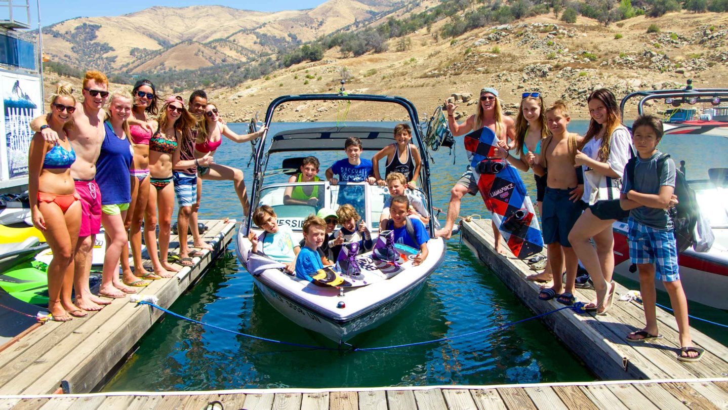 Campers getting in the boat to go waterskiing and wakeboarding