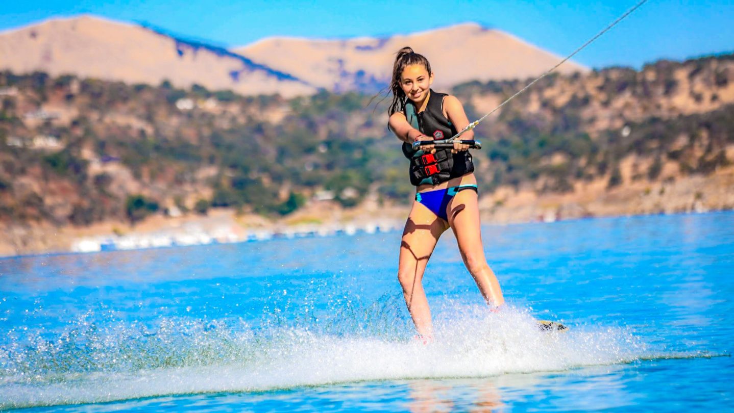 A camper learning how to waterski