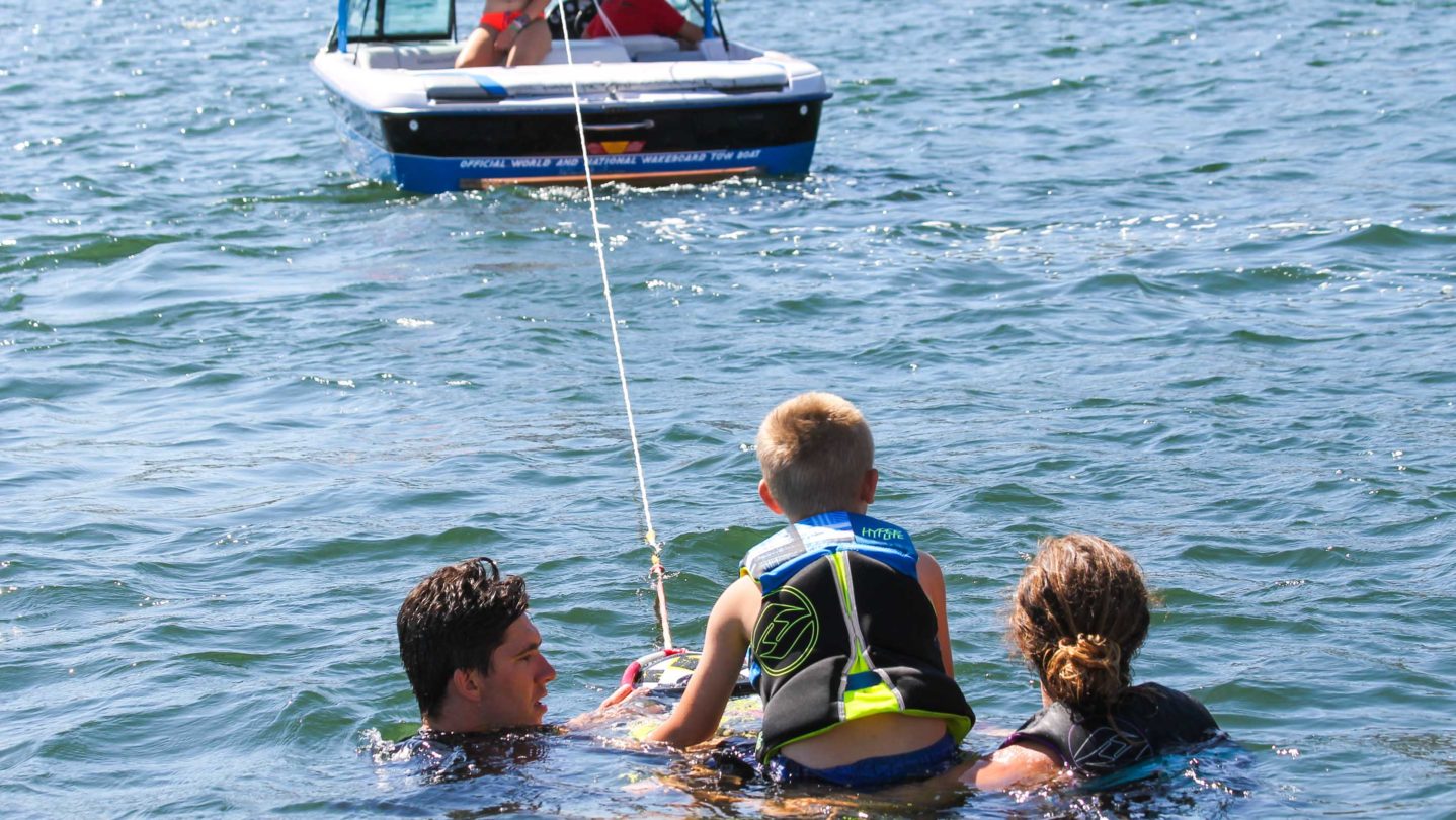 A camper getting ready to learn how to wakeboard