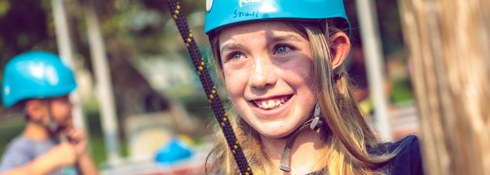 A camper smiling at the camera.