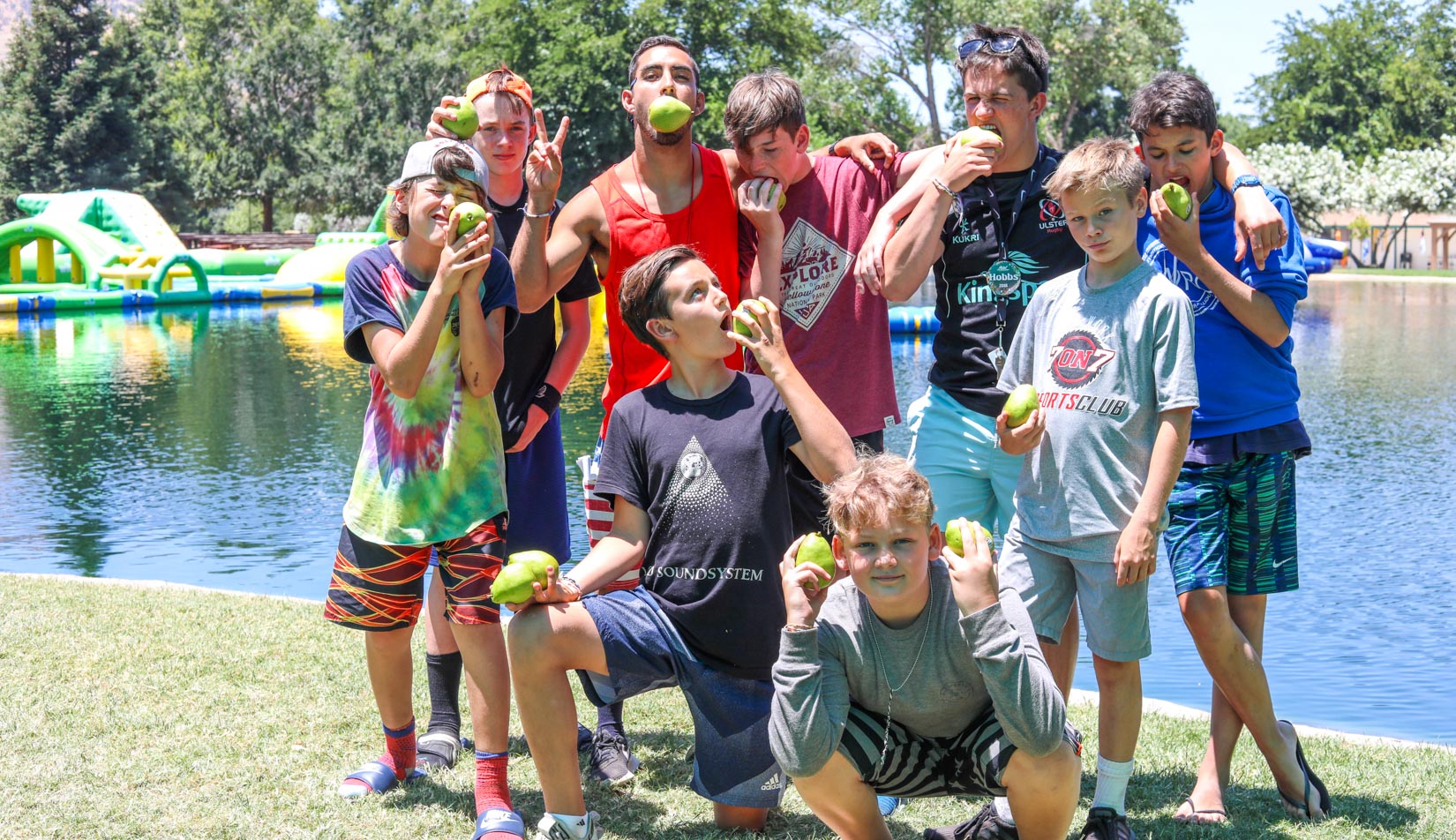 Campers posing for a group photo with pears