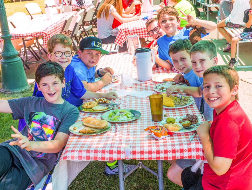 Campers enjoying a meal together